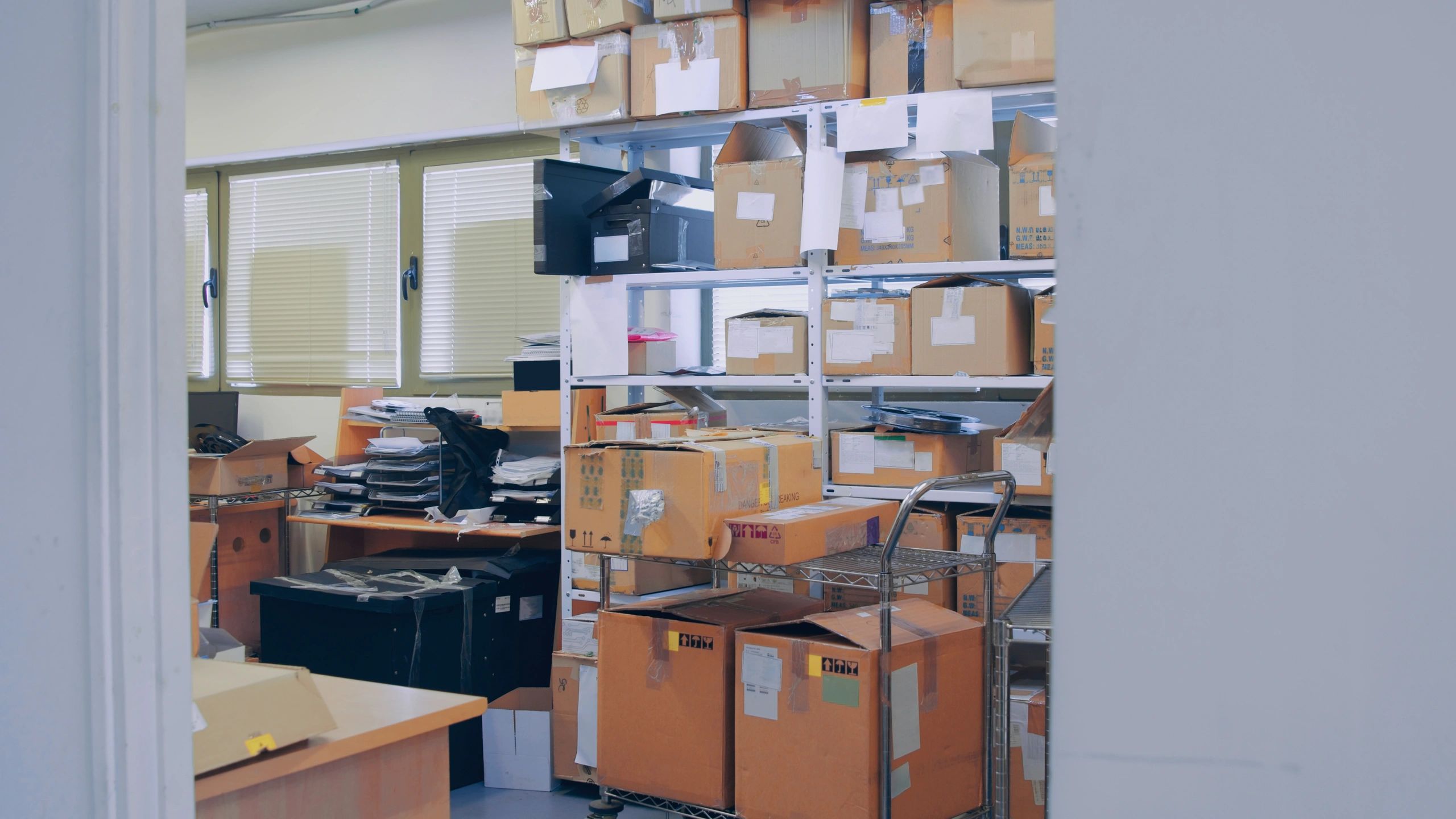 Shelving and packaged box inventory in production space