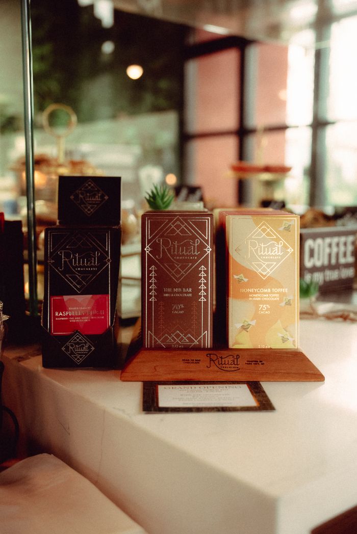 Elegantly displayed artisanal chocolate bars in a chic boutique setting.